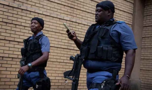 হোস্টেলের গোপন পানশালায় নির্বিচারে গুলি, শিশুসহ নিহত ১২